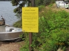 Dead tree warning sign at boat launch